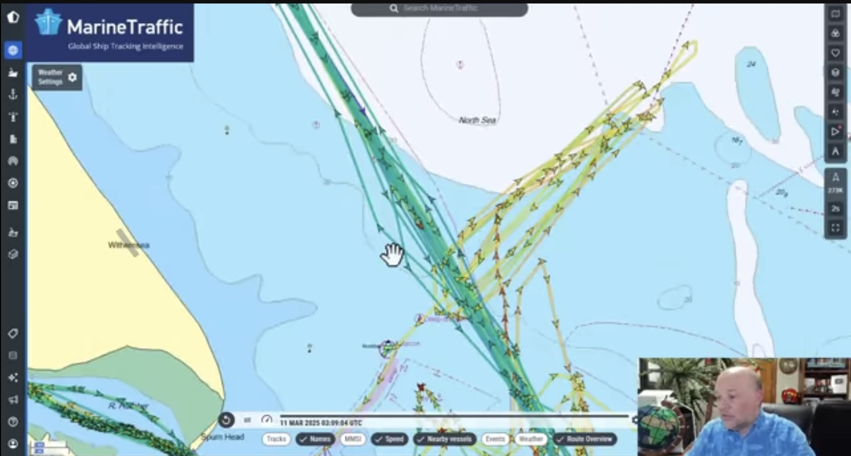 YouTube Video Screenshot: Presenter overlaid over nautical map with ship navigation trails for Solong and Stena Immaculate. Both trails cross several times. The impact point is inside a repeat track for Solong.